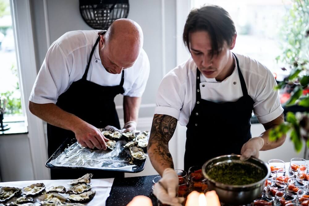 Two chefs cooking together