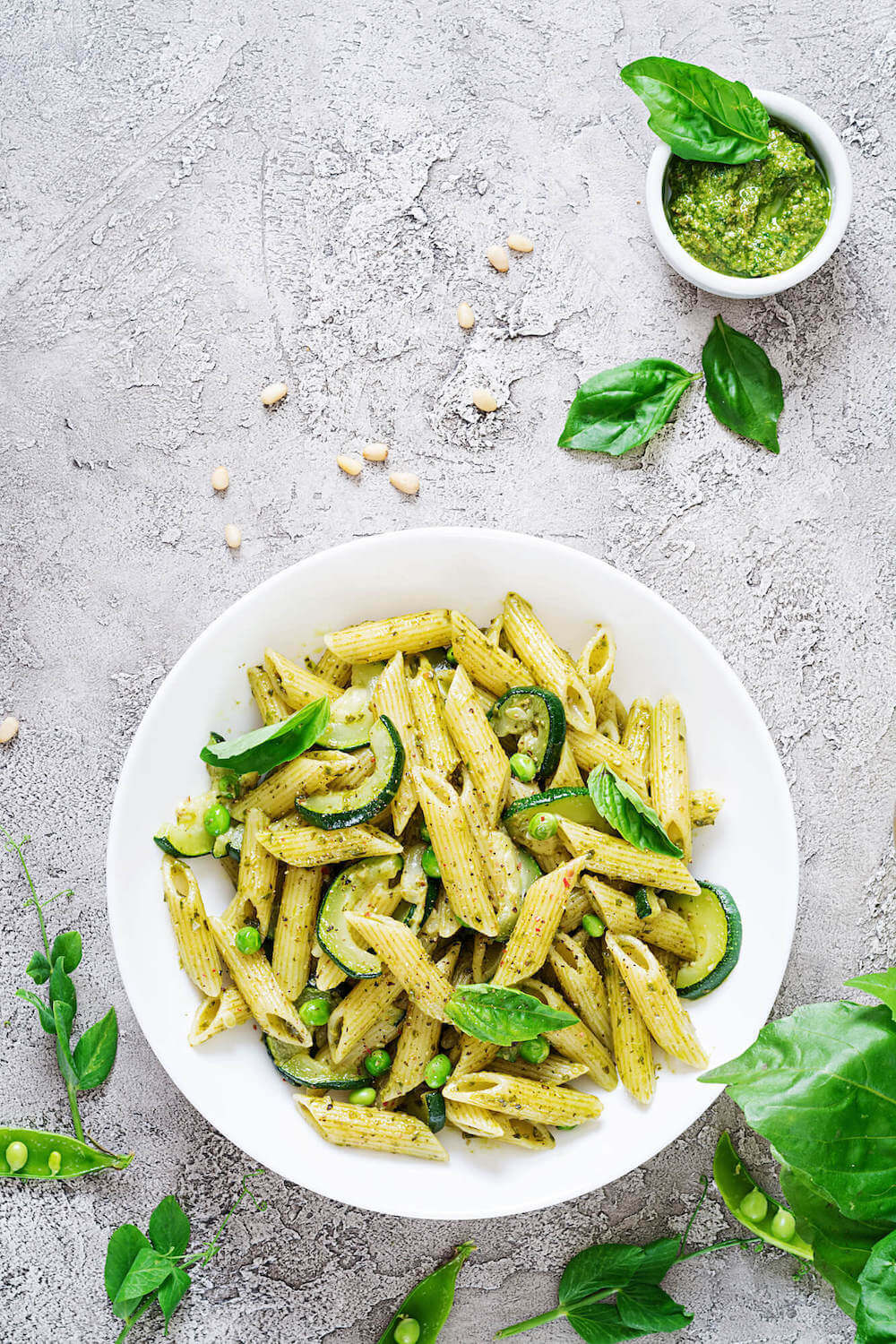 A bowl of penne pasta with pesto