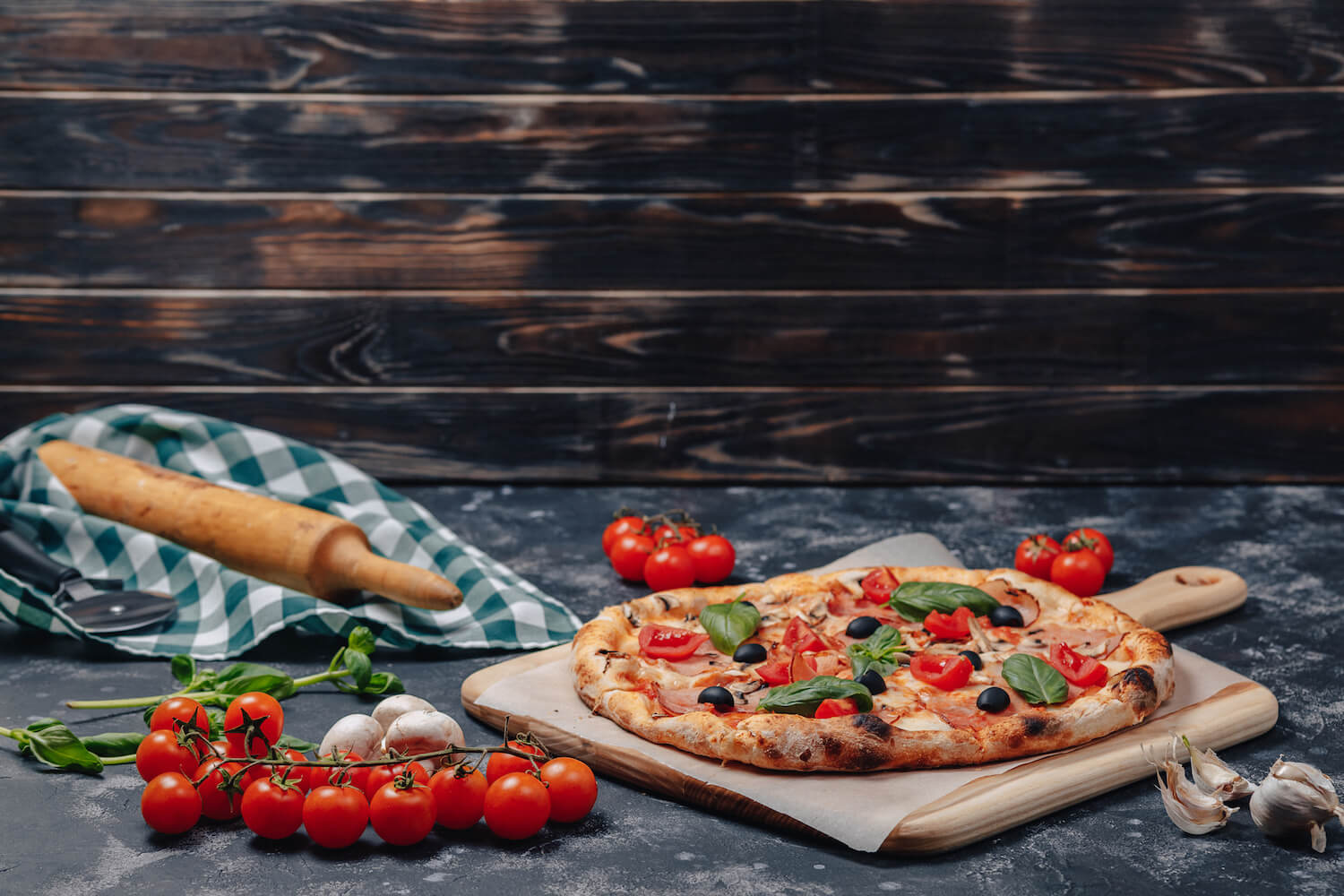 A pepperoni neapolitan pizza on a board