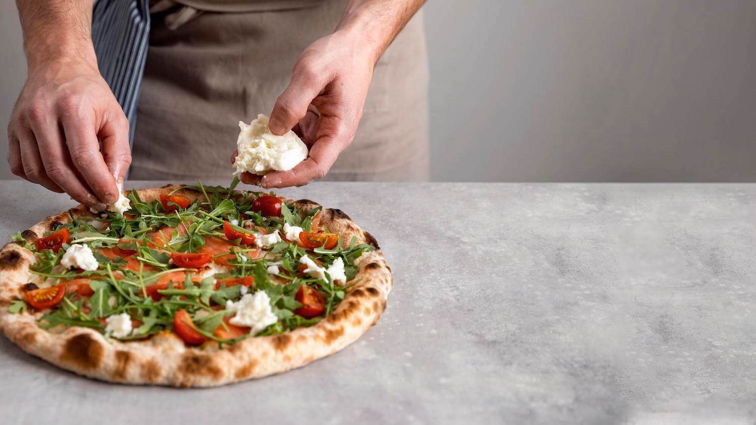 A pizza topped with fresh rocket